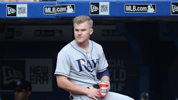 TORONTO, ON - AUGUST 11: Jake Bauers #9 of the Tampa Bay Rays looks on as he sits on the railing in the dugout during MLB game action against the Toronto Blue Jays at Rogers Centre on August 11, 2018 in Toronto, Canada. (Photo by Tom Szczerbowski/Getty Images)
