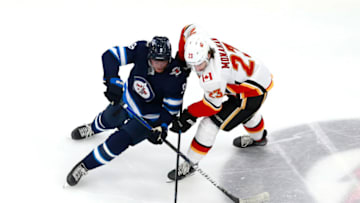Winnipeg Jets, Andrew Copp #9, Calgary Flames, Sean Monahan #23 (Photo by Jeff Vinnick/Getty Images)