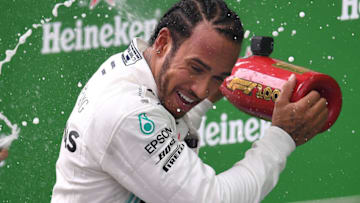 SHANGHAI, CHINA - APRIL 14: Race winner Lewis Hamilton of Great Britain and Mercedes GP celebrates on the podium during the F1 Grand Prix of China at Shanghai International Circuit on April 14, 2019 in Shanghai, China. (Photo by Clive Mason/Getty Images)