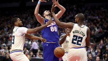 SACRAMENTO, CALIFORNIA - JANUARY 10: Nemanja Bjelica #88 of the Sacramento Kings loses the ball while covered by Sterling Brown #23 and Khris Middleton #22 of the Milwaukee Bucks at Golden 1 Center on January 10, 2020 in Sacramento, California. NOTE TO USER: User expressly acknowledges and agrees that, by downloading and or using this photograph, User is consenting to the terms and conditions of the Getty Images License Agreement. (Photo by Ezra Shaw/Getty Images)