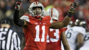 Nov 21, 2015; Columbus, OH, USA; Ohio State Buckeyes safety Vonn Bell (11) tries to fire up the fans during the game against the Michigan State Spartans at Ohio Stadium. Michigan State won the game 17-14. Mandatory Credit: Greg Bartram-USA TODAY Sports