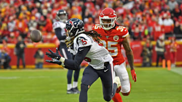 KANSAS CITY, MISSOURI - JANUARY 12: Wide receiver Will Fuller #15 of the Houston Texans catches a pass down field against cornerback Charvarius Ward #35 of the Kansas City Chiefs in the second half during the AFC Divisional playoff game at Arrowhead Stadium on January 12, 2020 in Kansas City, Missouri. (Photo by Peter G. Aiken/Getty Images)