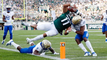 ;Manny BunchEAST LANSING, MI - AUGUST 30: Connor Heyward #11 of the Michigan State Spartans dives toward the end zone pylon for a 15-yard touchdown in the first quarter against Manny Bunch #10 of the Tulsa Golden Hurricane at Spartan Stadium on August 30, 2019 in East Lansing, Michigan. (Photo by Joe Robbins/Getty Images)
