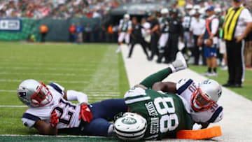 EAST RUTHERFORD, NJ - OCTOBER 15: Tight end Austin Seferian-Jenkins No. 88 of the New York Jets is seen after what was originally called a touchdown against strong safety Duron Harmon No. 30 and cornerback Malcolm Butler No. 21 of the New England Patriots during the fourth quarter of their game at MetLife Stadium on October 15, 2017 in East Rutherford, New Jersey. The Replay Official reviewed the runner broke the plane ruling, and the play was reversed and called a fumble. (Photo by Al Bello/Getty Images)