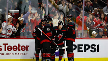 RALEIGH, NC - NOVEMBER 18: Sebastian Aho #20 of the Carolina Hurricanes celebrates with teammates after scoring a goal during the second period of the game against the Pittsburgh Penguins at PNC Arena on November 18, 2023 in Raleigh, North Carolina. (Photo by Jaylynn Nash/Getty Images)