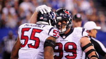 Dec 20, 2015; Indianapolis, IN, USA; Houston Texans defensive end J.J. Watt (99) and linebacker Benardrick McKinney (55) celebrate a tackle in the second half against the Indianapolis Colts at Lucas Oil Stadium. The Texans won 16-10. Mandatory Credit: Thomas J. Russo-USA TODAY Sports