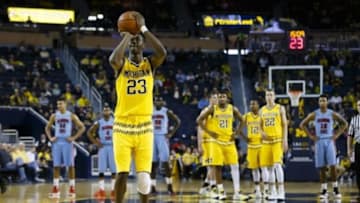 Dec 12, 2015; Ann Arbor, MI, USA; Michigan Wolverines guard Caris LeVert (23) takes a free throw on a technical foul against the Delaware State Hornets in the first half at Crisler Center. Mandatory Credit: Rick Osentoski-USA TODAY Sports