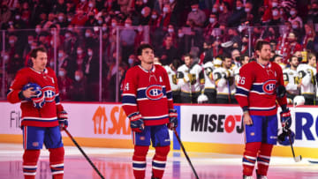 MONTREAL, QC - NOVEMBER 06: (L-R) Brendan Gallagher #11, Nick Suzuki and Jeff Petry #26 of the Montreal Canadiens stand during the anthems prior to the game against the Vegas Golden Knights at Centre Bell on November 6, 2021 in Montreal, Canada. The Vegas Golden Knights defeated the Montreal Canadiens 5-2. (Photo by Minas Panagiotakis/Getty Images)