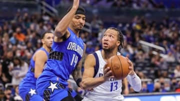 Dallas Mavericks guard Jalen Brunson (13) drives to the basket against Orlando Magic guard Gary Harris Credit: Mike Watters-USA TODAY Sports