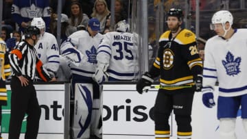 Mar 29, 2022; Boston, Massachusetts, USA; Toronto Maple Leafs goaltender Petr Mrazek (35) passes goaltender Erik Kallgren (50) as he heads for the locker room after being injured during the first period against the Boston Bruins at TD Garden. Mandatory Credit: Winslow Townson-USA TODAY Sports