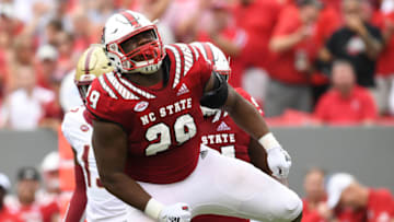 RALEIGH, NC - OCTOBER 06: Alim McNeill #29 of the North Carolina State Wolfpack reacts after making as tackle for a loss against the Boston College Eagles during their game at Carter-Finley Stadium on October 6, 2018 in Raleigh, North Carolina. (Photo by Grant Halverson/Getty Images)