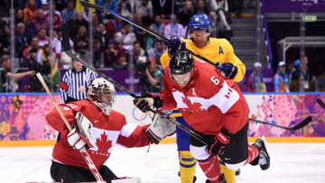 Sweden's Daniel Alfredsson (C) vies with Canada's Shea Weber (R) and Canada's goalkeeper Carey Price during the Men's ice hockey final Sweden vs Canada at the Bolshoy Ice Dome during the Sochi Winter Olympics on February 23, 2014. AFP PHOTO / ANDREJ ISAKOVIC (Photo credit should read ANDREJ ISAKOVIC/AFP via Getty Images)