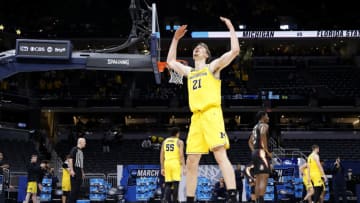 INDIANAPOLIS, INDIANA - MARCH 28: Franz Wagner #21 of the Michigan Wolverines celebrates in the final moments of the second half of their Sweet Sixteen round game against the Florida State Seminoles in the 2021 NCAA Men's Basketball Tournament at Bankers Life Fieldhouse on March 28, 2021 in Indianapolis, Indiana. (Photo by Jamie Squire/Getty Images)