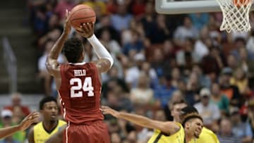 March 26, 2016; Anaheim, CA, USA; Oklahoma Sooners guard Buddy Hield (24) shoots a basket against Oregon Ducks during the second half of the West regional final of the NCAA Tournament at Honda Center. Mandatory Credit: Robert Hanashiro-USA TODAY Sports