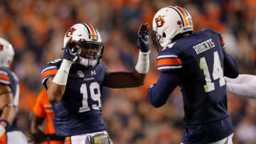 AUBURN, AL - NOVEMBER 25: Nick Ruffin #19 and Stephen Roberts #14 of the Auburn Tigers celebrate after the victory over the Alabama Crimson Tide at Jordan Hare Stadium on November 25, 2017 in Auburn, Alabama. (Photo by Kevin C. Cox/Getty Images)