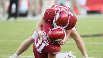 Oct 17, 2020; Fayetteville, Arkansas, USA; Arkansas Razorbacks linebacker Hayden Henry (27) celebrates with linebacker Grant Morgan (31) after Morgan broke up a pass play by the Ole Miss Rebels at Donald W. Reynolds Razorback Stadium. Arkansa won 33-21. Mandatory Credit: Nelson Chenault-USA TODAY Sports
