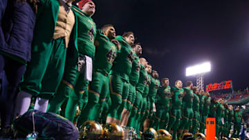 BOSTON, MA - NOVEMBER 21: The Notre Dame Fighting Irish celebrate a win against the Boston College Eagles by singing their school song with their fans at Fenway Park during the "Shamrock Series" on November 21, 2015 in Boston, Massachusetts. The Fighting Irish won 19-16. (Photo by Richard T Gagnon/Getty Images)