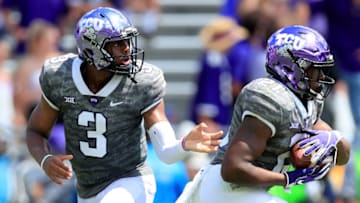 FORT WORTH, TX - SEPTEMBER 01: Shawn Robinson #3 of the TCU Horned Frogs hands the ball off to Emari Demercado #21 of the TCU Horned Frogs against the Southern University Jaguars in the second quarter at Amon G. Carter Stadium on September 1, 2018 in Fort Worth, Texas. (Photo by Tom Pennington/Getty Images)