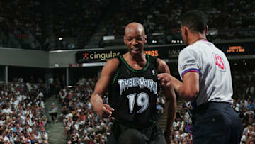 SACRAMENTO, CA - MAY 16: Sam Cassell #19 of the Minnesota Timberwolves and Chris Webber #4 of the Sacramento Kings get tangled up in Game six of the Western Conference Semifinal of the NBA Playoffs May 16, 2004 at Arco Arena in Sacramento, California. NOTE TO USER: User expressly acknowledges and agrees that, by downloading and/or using this Photograph, User is consenting to the terms and conditions of the Getty Images License Agreement. (Photo by Jed Jacobsohn/Getty Images)