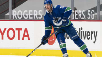 VANCOUVER, BC - MARCH 22: Travis Hamonic #27 of the Vancouver Canucks skates during NHL action against the Winnipeg Jets at Rogers Arena on March 22, 2021 in Vancouver, Canada. (Photo by Rich Lam/Getty Images)