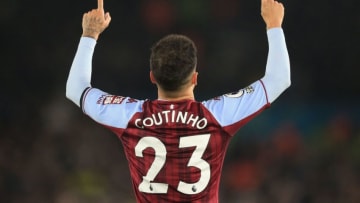 Philippe Coutinho celebrates after scoring the opening goal of the match between Leeds United and Aston Villa at Elland Road in Leeds, northern England on March 10, 2022. (Photo by LINDSEY PARNABY/AFP via Getty Images)