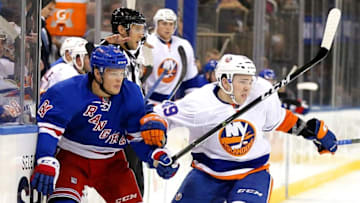 Sep 27, 2016; New York, NY, USA; New York Rangers right wing Malte Stromwall (84) and New York Islanders defenseman David Quenneville (49) come together during the third period during a preseason hockey game at Madison Square Garden. The Rangers won 5-2. Mandatory Credit: Andy Marlin-USA TODAY Sports