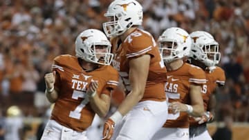 AUSTIN, TX - SEPTEMBER 04: Shane Buechele #7 of the Texas Longhorns celebrates with teammates after a second quarter touchdown against the Notre Dame Fighting Irish at Darrell K. Royal-Texas Memorial Stadium on September 4, 2016 in Austin, Texas. (Photo by Ronald Martinez/Getty Images)