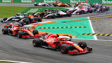 MONZA, ITALY - SEPTEMBER 02: Kimi Raikkonen of Finland driving the (7) Scuderia Ferrari SF71H leads Sebastian Vettel of Germany driving the (5) Scuderia Ferrari SF71H and the rest of the field at the start during the Formula One Grand Prix of Italy at Autodromo di Monza on September 2, 2018 in Monza, Italy. (Photo by Mark Thompson/Getty Images)