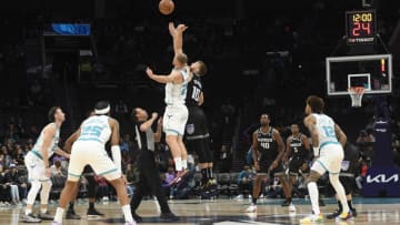 Oct 31, 2022; Charlotte, North Carolina, USA; Charlotte Hornets center Mason Plumlee (24) and Sacramento Kings forward center Domantas Sabonis (10) tip off the game at the Spectrum Center. Mandatory Credit: Sam Sharpe-USA TODAY Sports