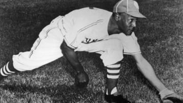 1Buck O'Neil of the Kansas City Monarchs demonstrates his first baseman's stretch(Photo by Mark Rucker/Transcendental Graphics/Getty Images)