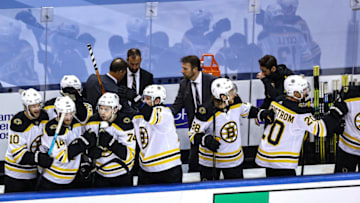 TORONTO, ONTARIO - AUGUST 23: The Boston Bruins celebrate their 3-2 victory against the Tampa Bay Lightning during the third period in Game One of the Eastern Conference Second Round during the 2020 NHL Stanley Cup Playoffs at Scotiabank Arena on August 23, 2020 in Toronto, Ontario. (Photo by Elsa/Getty Images)