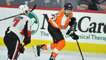 Mar 11, 2019; Philadelphia, PA, USA; Philadelphia Flyers center Claude Giroux (28) carries the puck past Ottawa Senators left wing Brady Tkachuk (7) during the third period at Wells Fargo Center. Mandatory Credit: Eric Hartline-USA TODAY Sports