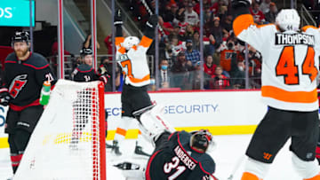 Nov 12, 2021; Raleigh, North Carolina, USA; Philadelphia Flyers center Zack MacEwen (17) scores a third period goal behind Carolina Hurricanes goaltender Frederik Andersen (31) at PNC Arena. Mandatory Credit: James Guillory-USA TODAY Sports