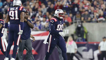 FOXBOROUGH, MA - OCTOBER 04: Malcom Brown #90 of the New England Patriots is assisted by training staff during the first half against the Indianapolis Colts at Gillette Stadium on October 4, 2018 in Foxborough, Massachusetts. (Photo by Maddie Meyer/Getty Images)