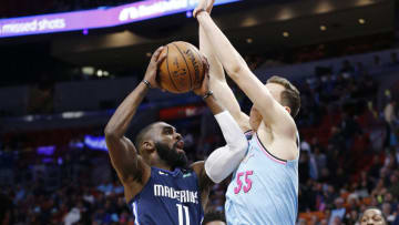 MIAMI, FLORIDA - FEBRUARY 28: Tim Hardaway Jr. #11 of the Dallas Mavericks shot is defended by Duncan Robinson #55 of the Miami Heat during the first half at American Airlines Arena on February 28, 2020 in Miami, Florida. NOTE TO USER: User expressly acknowledges and agrees that, by downloading and/or using this photograph, user is consenting to the terms and conditions of the Getty Images License Agreement. (Photo by Michael Reaves/Getty Images)