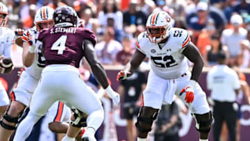 Auburn footballSep 23, 2023; College Station, Texas, USA; Auburn Tigers offensive lineman Dillon Wade (52) in action during the second quarter against the Texas A&M Aggies at Kyle Field. Mandatory Credit: Maria Lysaker-USA TODAY Sports