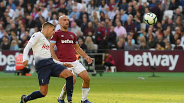 LONDON, ENGLAND - OCTOBER 20: Erik Lamela of Tottenham Hotspur scores his team's first goal while under pressure from Pablo Zabaleta of West Ham United during the Premier League match between West Ham United and Tottenham Hotspur at London Stadium on October 20, 2018 in London, United Kingdom. (Photo by Mike Hewitt/Getty Images)