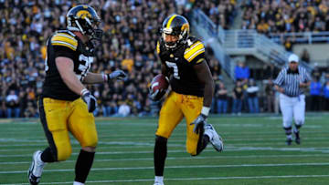 IOWA CITY, IA - OCTOBER 30- Wide receiver Marvin McNutt #7 of the University of Iowa Hawkeyes drives the ball into the end zone for a touch down during the second half of play against the Michigan State Spartans at Kinnick Stadium on October 30, 2010 in Iowa City, Iowa. Iowa won 37-6 over Michigan State. (Photo by David Purdy/Getty Images)