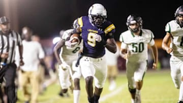 LehighÕs Richard Young runs for yardage in the first half against Palmetto Ridge at Lehigh on Friday, October, 22, 2021. Lehigh won.Lehigh Vspalmetto008