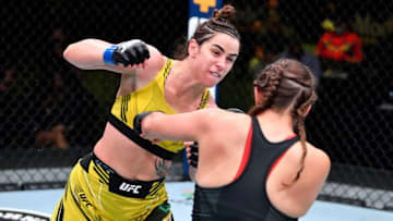 LAS VEGAS, NEVADA - MAY 22: In this handout image provided by UFC, (L-R) Norma Dumont Viana of Brazil punches Felicia Spencer of Canada in their women's featherweight bout during the UFC Fight Night event at UFC APEX on May 22, 2021 in Las Vegas, Nevada. (Photo by Chris Unger/Zuffa LLC via Getty Images)