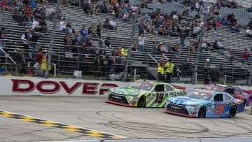 Oct 2, 2016; Dover, DE, USA; Xfinity Series driver Daniel Suarez (19) and driver Erik Jones (20) during the Drive Sober 200 race at Dover International Raceway. Mandatory Credit: Jerome Miron-USA TODAY Sports
