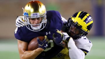 SOUTH BEND, IN - SEPTEMBER 01: Khaleke Hudson #7 of the Michigan Wolverines tackles Chris Finke #10 of the Notre Dame Fighting Irish in the second quarter at Notre Dame Stadium on September 1, 2018 in South Bend, Indiana. (Photo by Gregory Shamus/Getty Images)
