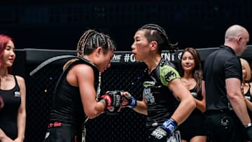 Angela Lee and Xiong Jingnan shake hands following their ONE: Century title fight (Photo via ONE Championship)