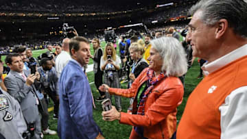 Clemson Head Coach Dabo Swinney, left, hugs Marcie Radakovich near Athletic Director Dan Radakovich on the field before of the College Football Playoff National Championship game in New Orleans Monday, January 13, 2020.Pregame Fans Clemson Lsu Football Cfp National Championship New Orleans