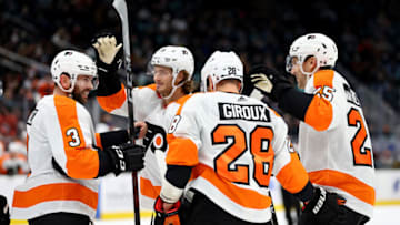 SEATTLE, WASHINGTON - DECEMBER 29: James van Riemsdyk #25 of the Philadelphia Flyers celebrates his power-play goal with Claude Giroux #28, Keith Yandle #3 and Joel Farabee #86 against the Seattle Kraken during the first period at Climate Pledge Arena on December 29, 2021 in Seattle, Washington. (Photo by Steph Chambers/Getty Images)