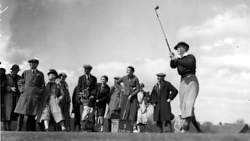 27th April 1936: US golfer Patty Berg in action during a game, watched by a group of spectators. (Photo by Fox Photos/Getty Images)