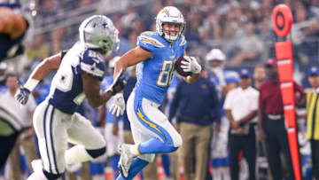 ARLINGTON, TX - NOVEMBER 23: Los Angeles Chargers tight end Hunter Henry (86) makes a catch and is pursued by Dallas Cowboys safety Xavier Woods (25) during the football game between the Los Angeles Chargers and Dallas Cowboys on November 23, 2017 at AT&T Stadium in Arlington, TX. (Photo by Andrew Dieb/Icon Sportswire via Getty Images)