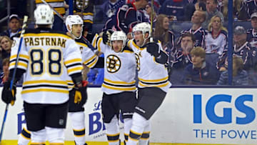 Oct 13, 2016; Columbus, OH, USA; Boston Bruins left wing Brad Marchand (middle) celebrates with teammates after scoring a goal against the Columbus Blue Jackets in the third period at Nationwide Arena. The Bruins won 6-3. Mandatory Credit: Aaron Doster-USA TODAY Sports