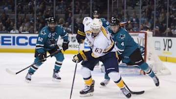 October 28, 2015; San Jose, CA, USA; Nashville Predators center Mike Ribeiro (63) controls the puck against San Jose Sharks right wing Joel Ward (42) and defenseman Brenden Dillon (4) during the third period at SAP Center at San Jose. The Predators defeated the Sharks 2-1. Mandatory Credit: Kyle Terada-USA TODAY Sports