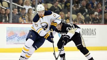 Mar 29, 2016; Pittsburgh, PA, USA; Buffalo Sabres center Jack Eichel (15) skates with the puck as Pittsburgh Penguins right wing Patric Hornqvist (72) defends during the first period at the CONSOL Energy Center. Mandatory Credit: Charles LeClaire-USA TODAY Sports